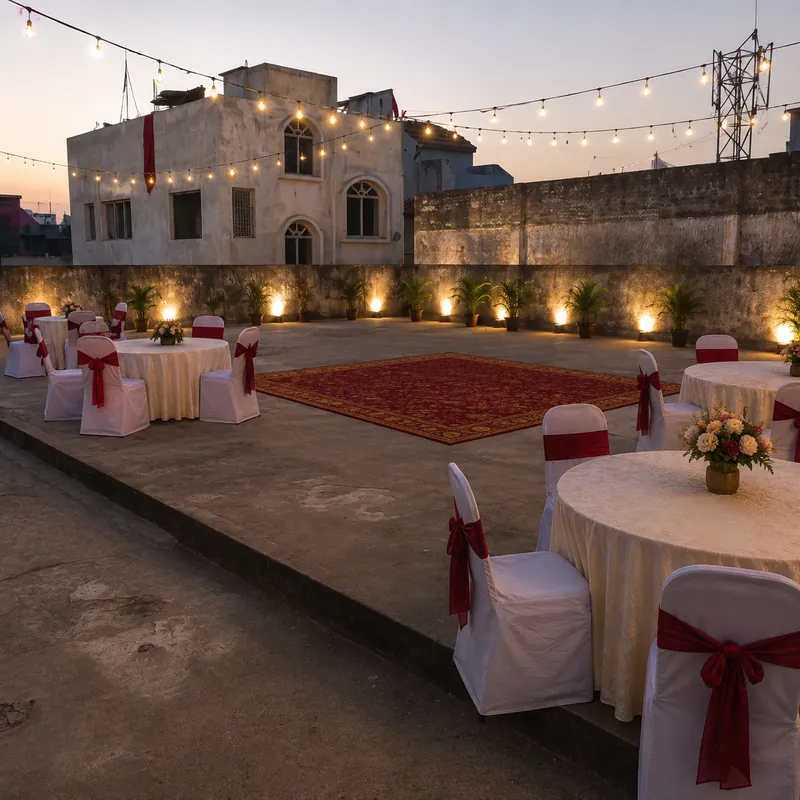 The courtyard of Patna City Marriage Hall glowing under festoon lights in the evening