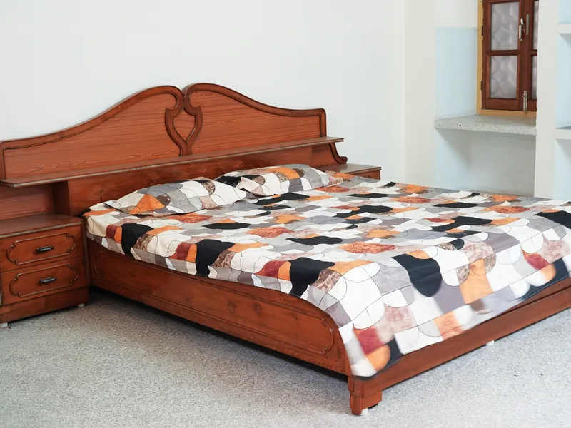 Guest room with a large wooden bed
