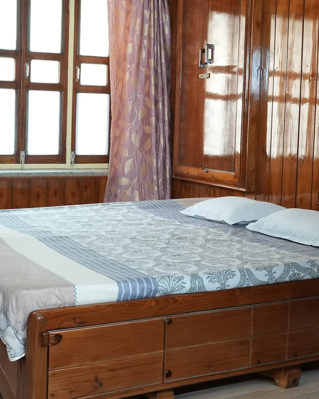 Wood-panelled room with a double bed